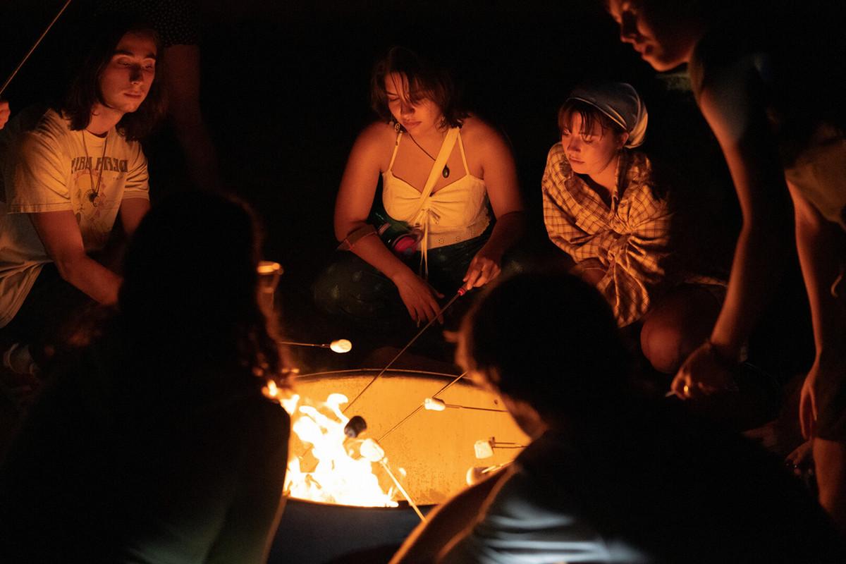 Students enjoying smores around a bonfire on a quick trip to Cheyenne Mountain State Park during NSO, organized by Outdoor Ed on Wednesday, 08/23/23. Photo by Mila Naumovska '26 / Colorado College.